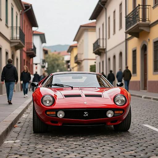 Red Bizzarrini Manta on Cobblestone Street