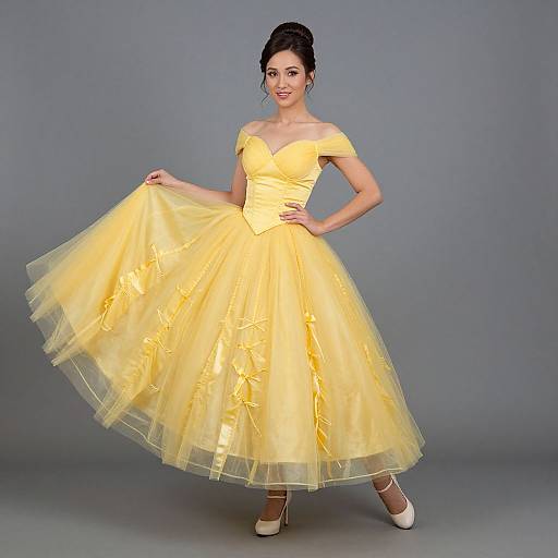 Photograph of a dark-haired woman in a vibrant yellow, off-the-shoulder, full-skirted ball gown, holding the skirt, wearing