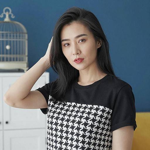 Asian Woman in Stylish Blue Room