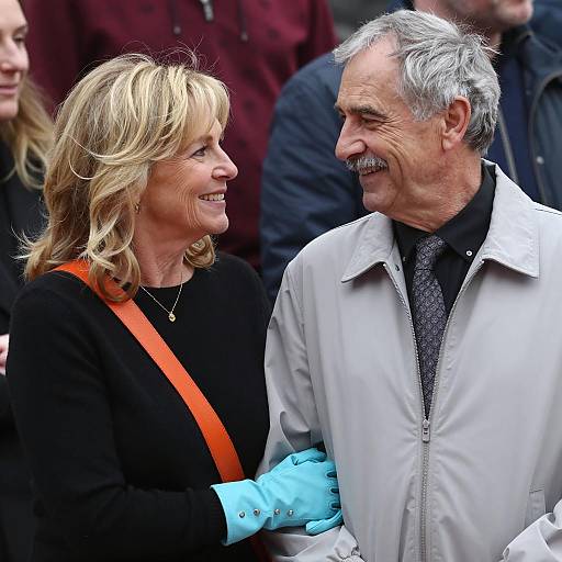 Smiling Middle-Aged Couple in Crowd
