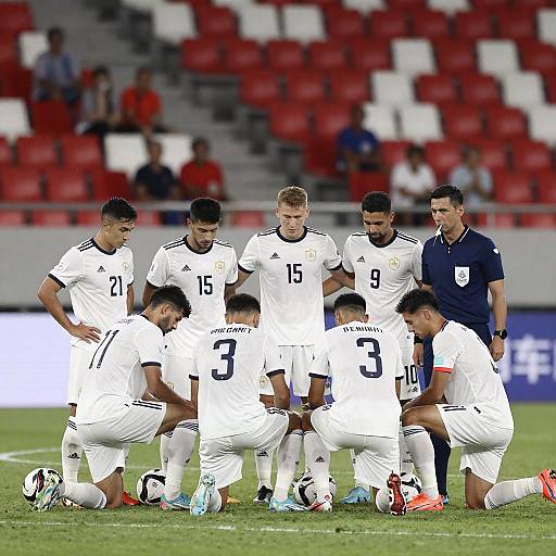 Soccer Team Huddle on Green Field