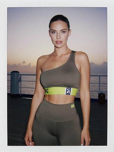 Stylish Athletic Woman on Ship Deck