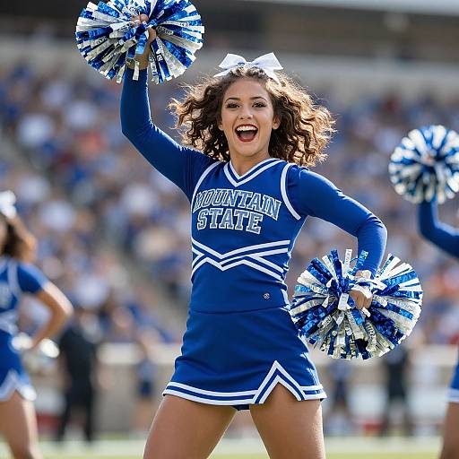 Photograph of a joyful, curly-haired brunette cheerleader in blue and white 