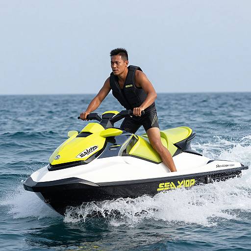 Photograph of a young Asian man with short black hair, wearing a black life vest and black swim trunks, riding a bright yellow and white jet