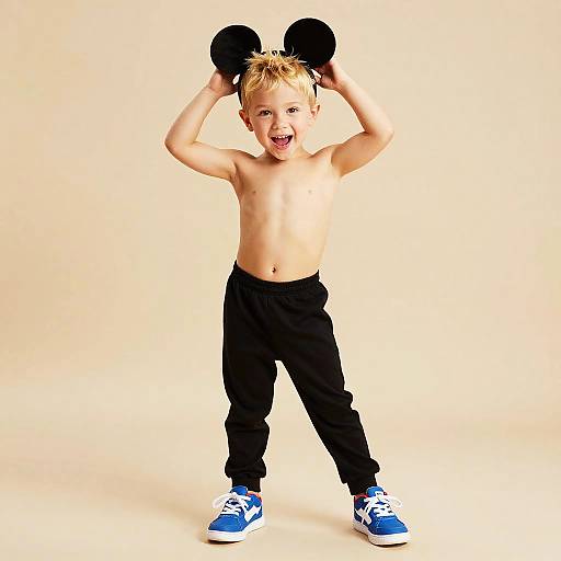 Playful Child in Mickey Mouse Outfit