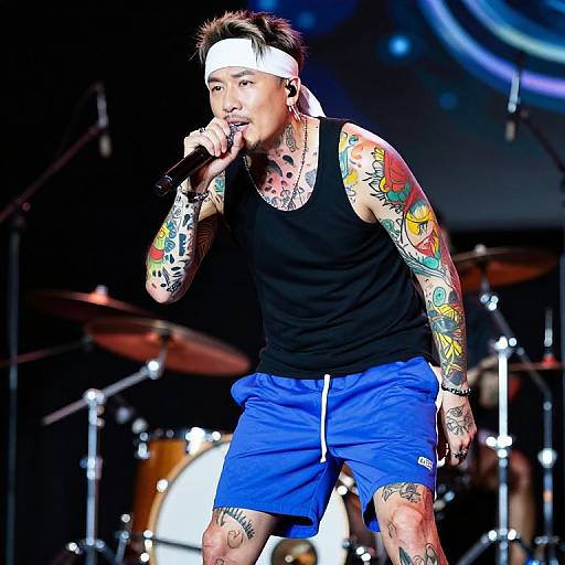Vibrant Tattooed Male Singer Performance
