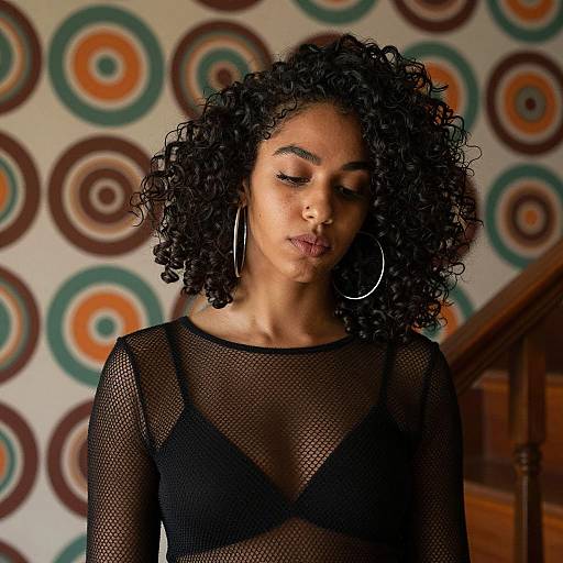 Stylish Woman with Curly Hair in Mesh Top