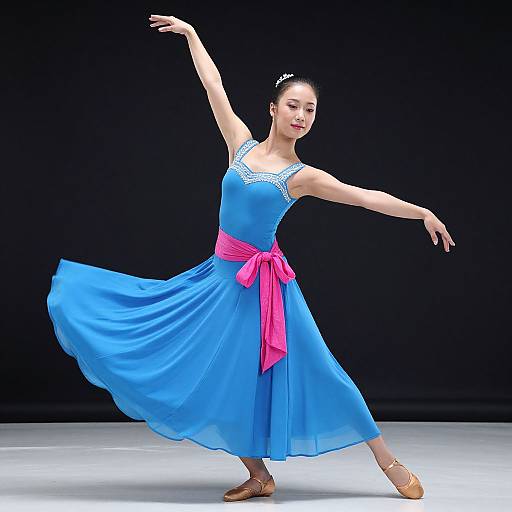 Photograph of a ballet dancer in a blue dress with pink ribbon, brown ballet slippers, black hair bun, against a black background, mid-p