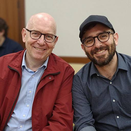 Two Smiling Men Sitting Together