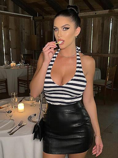 Photograph of a sleek, brunette woman with a high bun, wearing a striped halter top and black leather skirt, seductively licking a fork