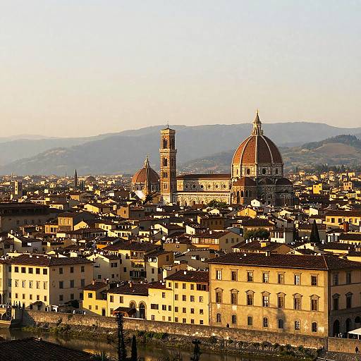 Photograph of Florence's historic skyline at sunset, featuring Duomo's red dome, Campanile tower, and surrounding yellow-tiled rooftops,