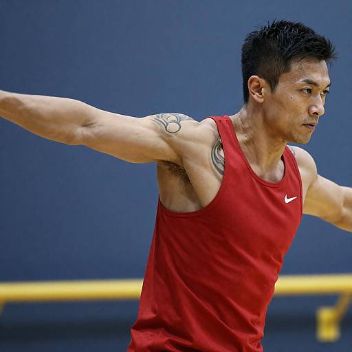 Muscular Man in Red Tank Mid-Motion