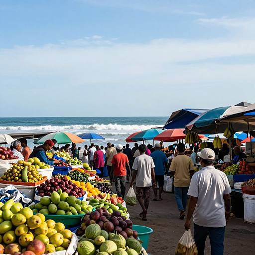Vibrant beach market scene photograph: colorful umbrellas, diverse crowd, baskets of fruits, ocean waves in background, sunny day, bustling atmosphere.