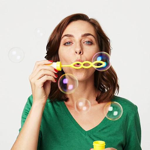 Woman Blowing Iridescent Bubbles