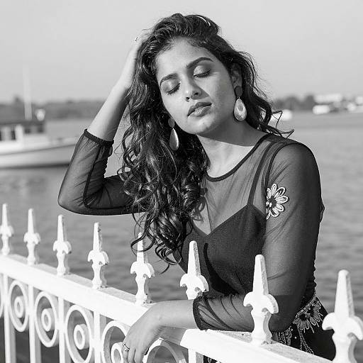 Elegant Woman by the Waterfront