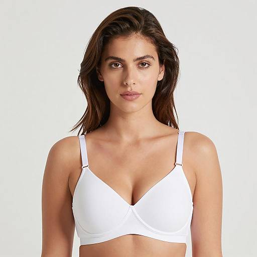 Woman in White Bra Against White Background