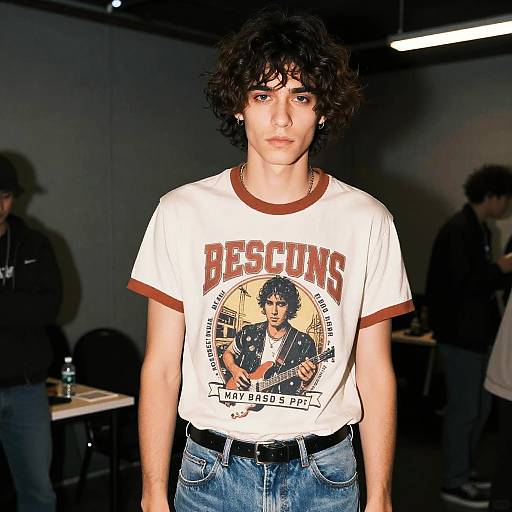 Young man with textured layers hairstyle in retro band t-shirt