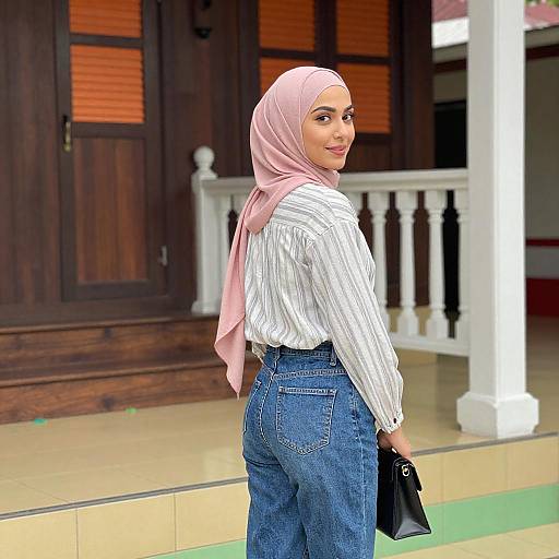 Woman in Pink Hijab on Tiled Porch