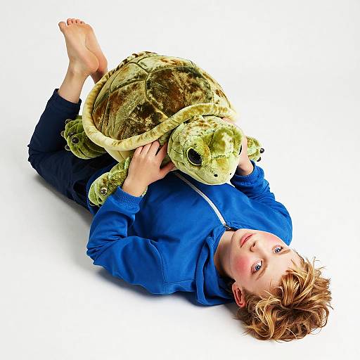 Curious Youth with Plush Turtle