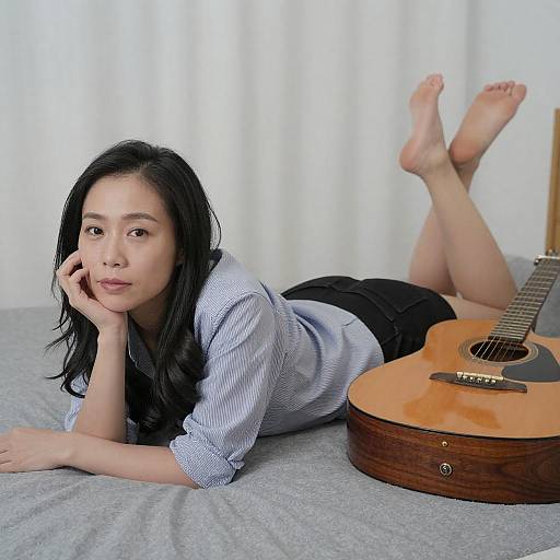 Relaxed Asian Woman with Guitar