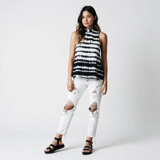 Woman in Black and White Tie-Dye Top with Distressed Jeans