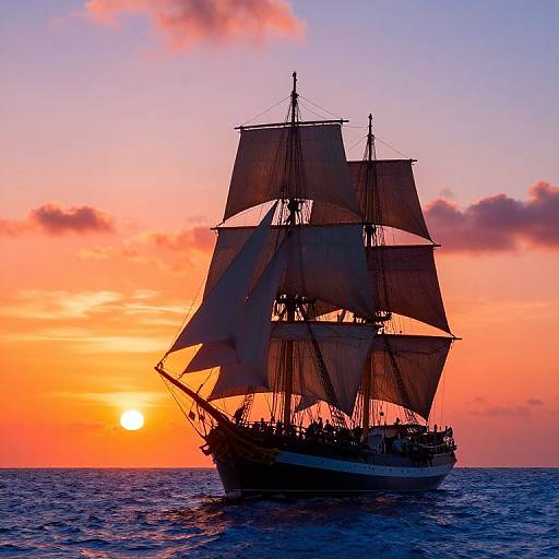 Photograph of a silhouetted, three-masted ship with unfurled sails against a vibrant orange and pink sunset over calm ocean waters.