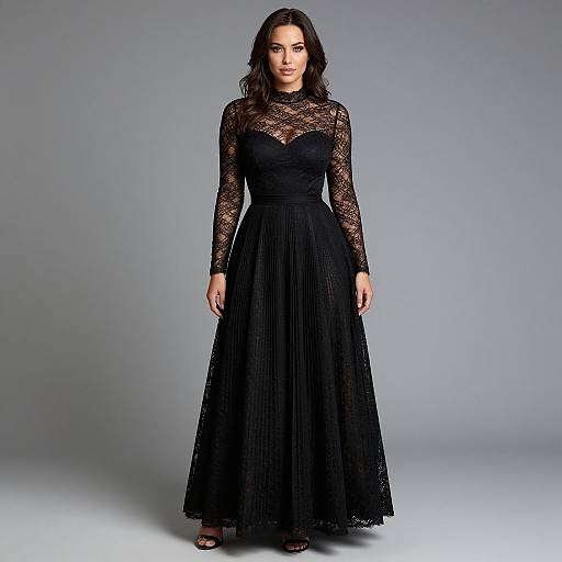 Photograph of a woman with wavy dark hair wearing a black, long-sleeved, lace bodice dress with a pleated skirt and open