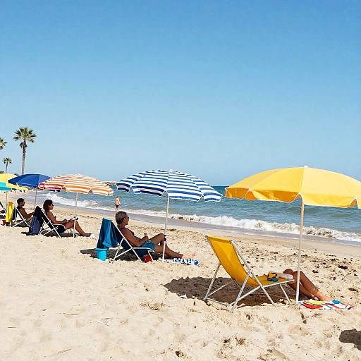 Photograph of a sunny beach with people lounging on yellow and blue chairs under colorful umbrellas, palm trees, and clear blue sky.