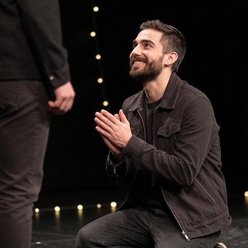 Kneeling Man Smiling at Standing Figure