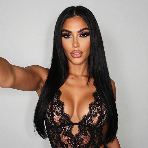 Woman in Black Lace Bodysuit Taking Selfie