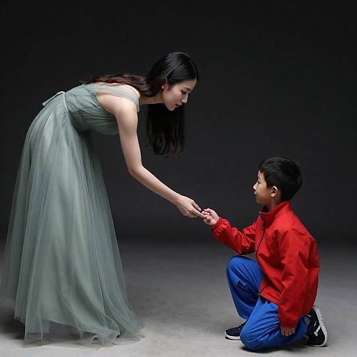 Woman in Green Dress Holding Boy's Hand