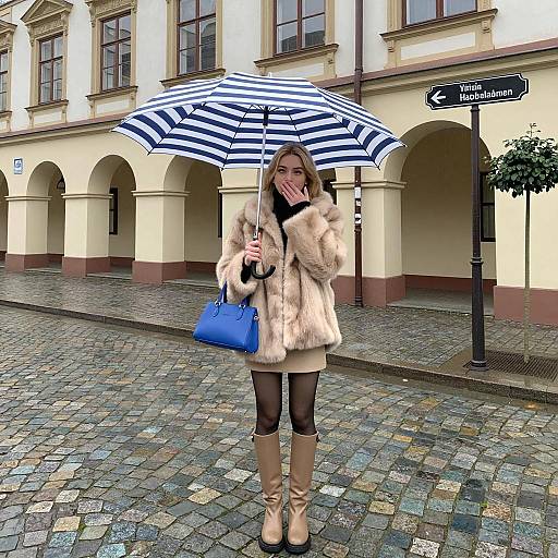 Chic Woman on Rainy Cobblestone Street
