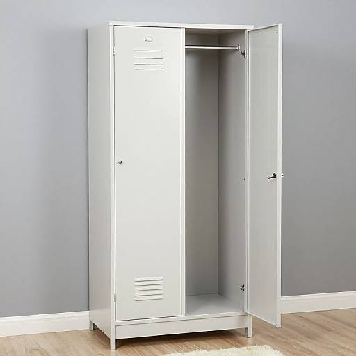 Photograph of a white, metal locker with one door open, showing an empty interior, against a gray wall and wooden floor.
