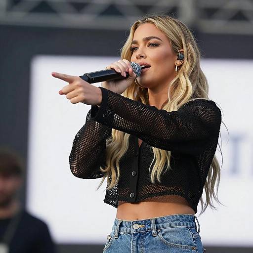 Blonde Woman Singing on Stage