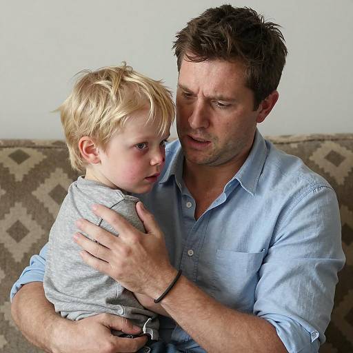 Concerned Father Comforting Injured Son