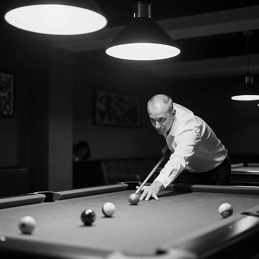 Bald Man Concentrating on Pool Game