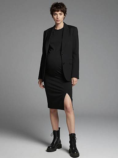 Pregnant Woman in Chic Black Maternity Outfit