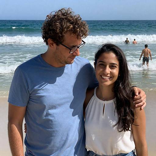 Couple Standing on Beach with Ocean Waves