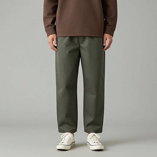 Man in Brown Shirt and Green Pants