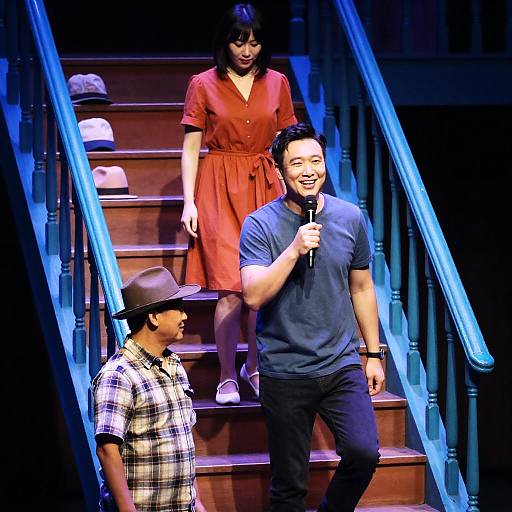 Actors Performing on Stage with Wooden Stairs