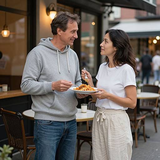 Couple Sharing Pasta at Twilight Café