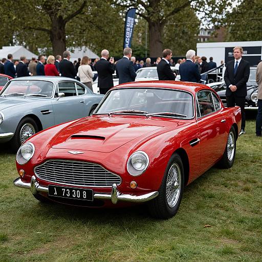 Photograph of a vibrant red classic Jaguar E-Type with a black license plate 