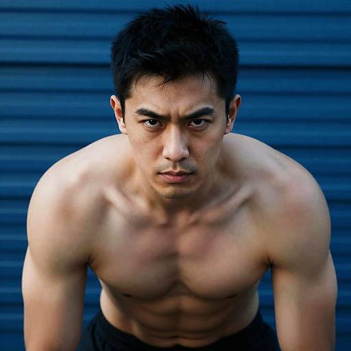 Intense Blue-Tinted Shirtless Muscular Man