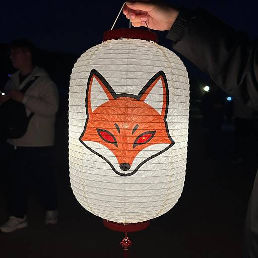 Illuminated Fox Lantern in Dark Night