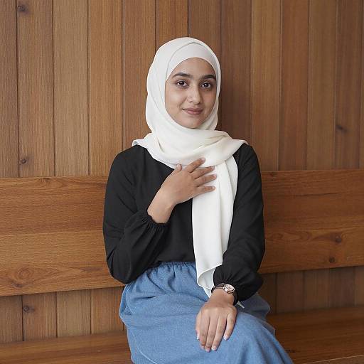 Young Woman in White Hijab Sitting