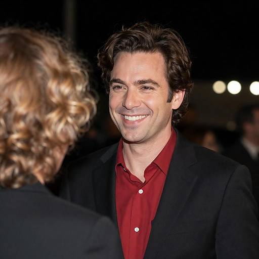 Smiling Man in Black Blazer at Night