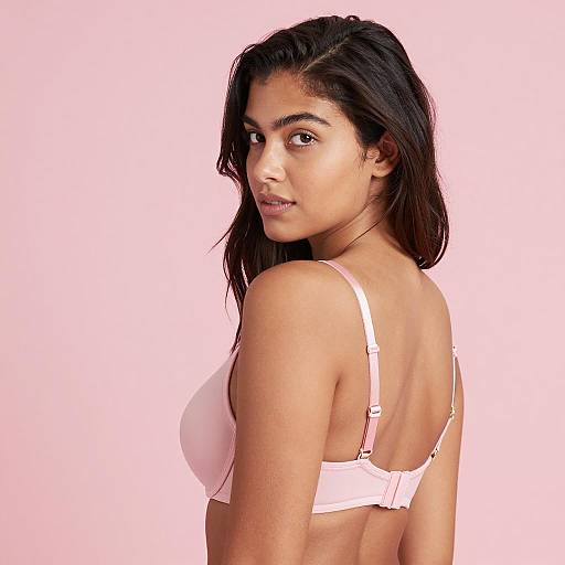 Woman in Pink Bra with Neutral Expression