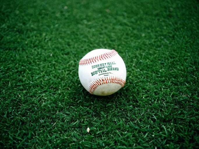 Vibrant Baseball Wallpaper with Green Background