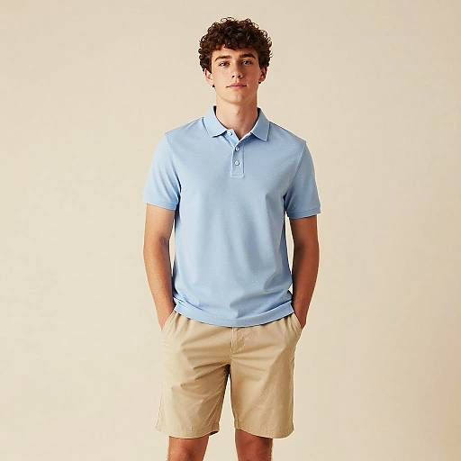 Young Man in Light Blue Polo and Beige Shorts