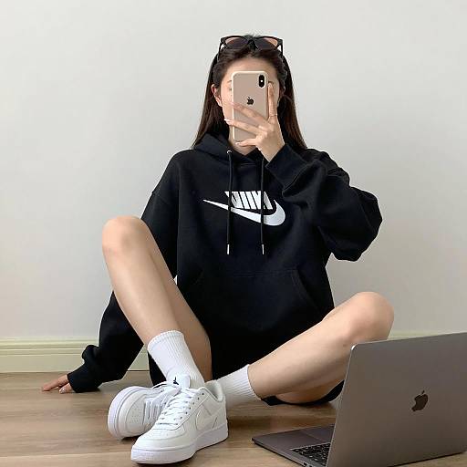 Woman in Black Nike Hoodie Taking Selfie